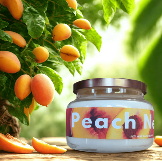 Jar of 'Peach Nectar' candle with peach slices and tree in the background