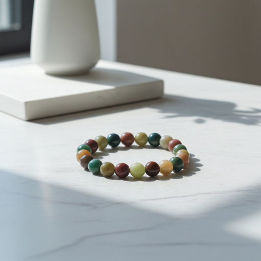Multicolored beaded bracelet on a light surface with a neutral background