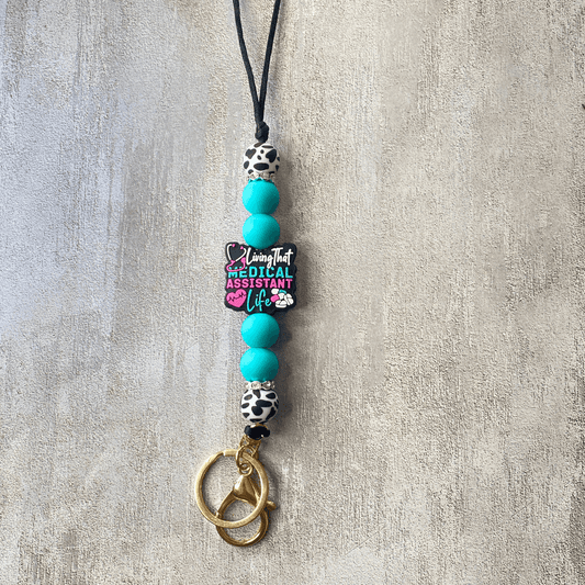 Necklace with turquoise beads and a pendant on a textured surface