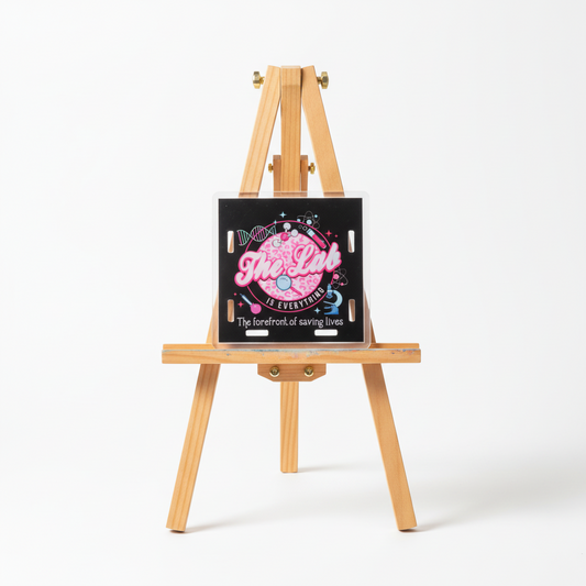 Decorative sign with 'The Lab is Everything' text and scientific symbols on a black background.