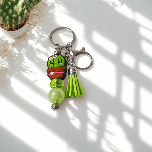 Keychain with cactus charm and tassel on a light background