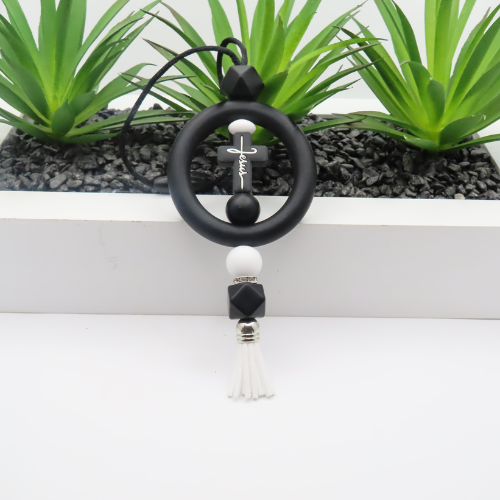 Black and white beaded keychain with tassel on a white background
