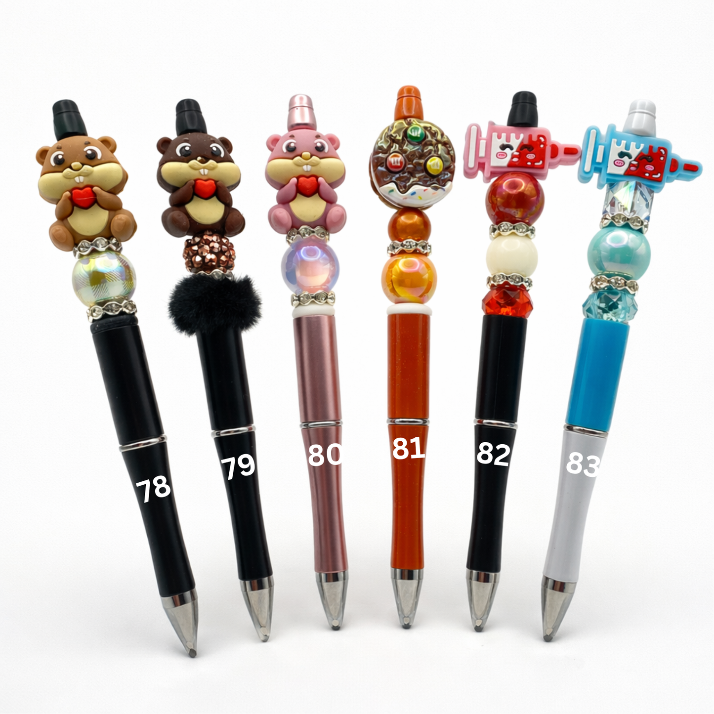 Set of decorative pens with unique designs and numbers on a white background