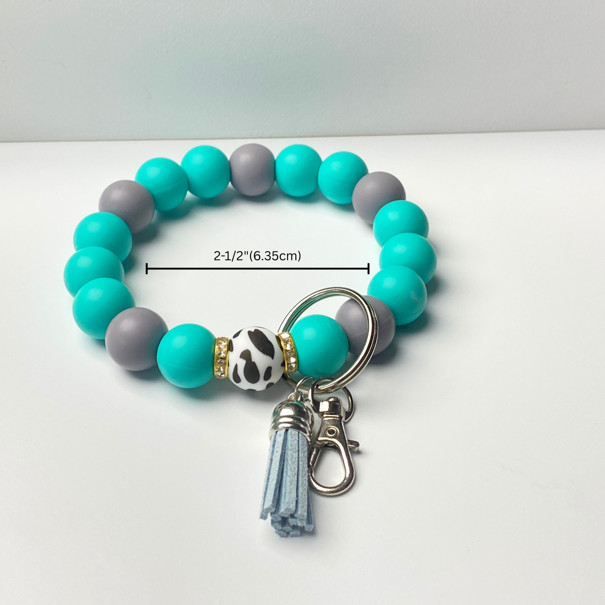 Beaded bracelet with keychain attachment on a white background