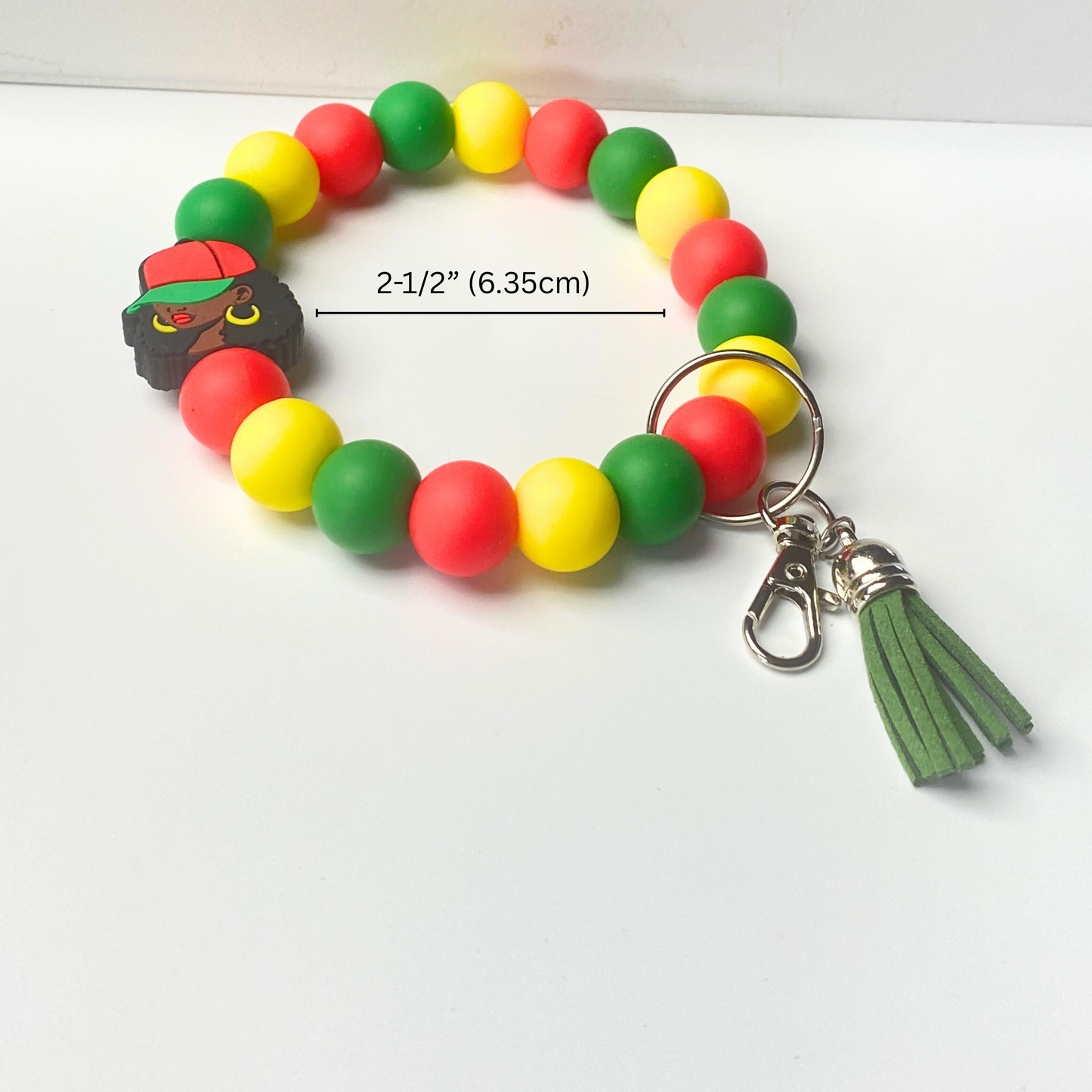 Colorful beaded keychain with a tassel on a white background