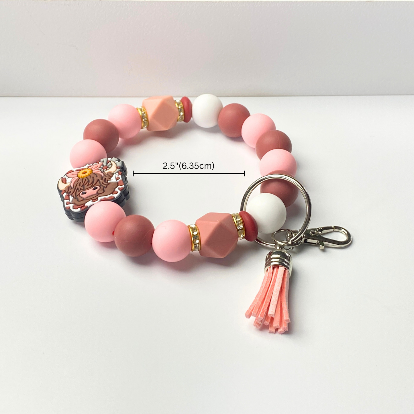 Beaded bracelet with keychain attachment on a white background