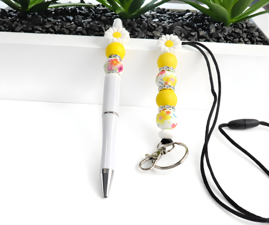 White pen with yellow bead holder and black lanyard on a white background