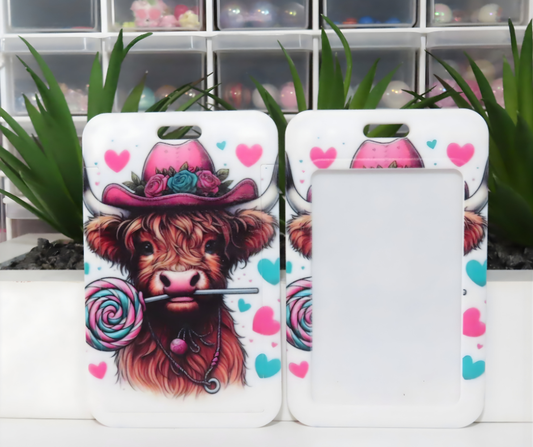 Phone case with a cow design holding a lollipop, set against a white background.