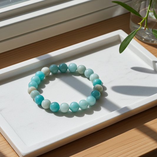 Turquoise beaded bracelet on a white tray with natural light
