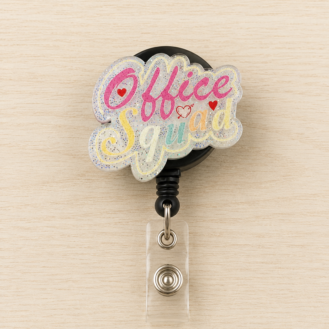 Retractable badge holder with 'Office Squad' design on a beige background
