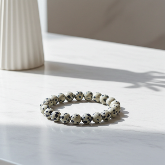 Bracelet with black and white beads on a light surface