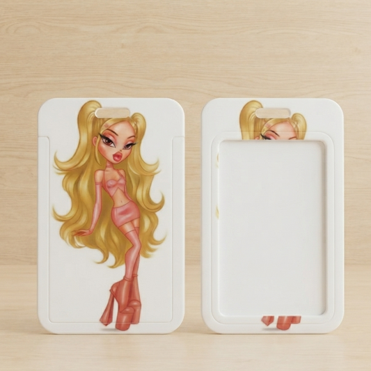 Two white rectangular picture frames with rounded corners displayed side by side on a light wood surface. The left frame shows a printed illustration of a blonde cartoon girl in a pink outfit, and the right frame is blank white with a small portion of a matching blonde illustration peeking out from the top.