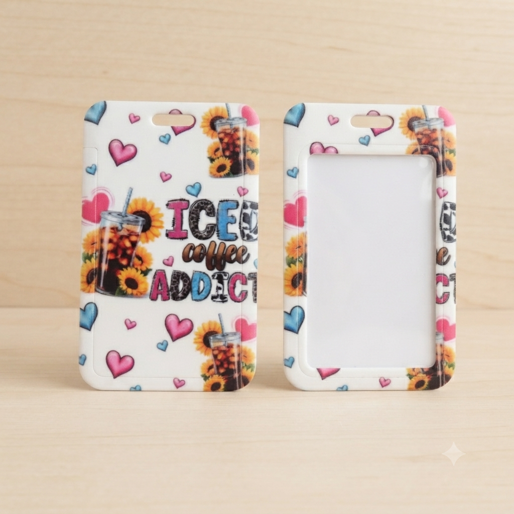 Two white phone cases with a colorful 'ICE coffee ADDICT!' graphic and sunflower/heart pattern, displayed side-by-side on a light wood background.