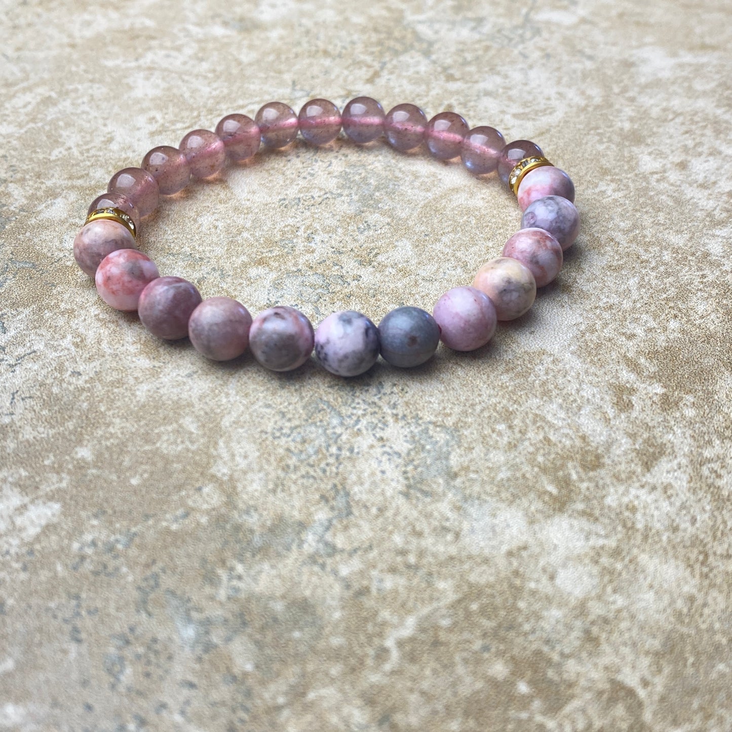 Multicolored beaded bracelet on a textured surface