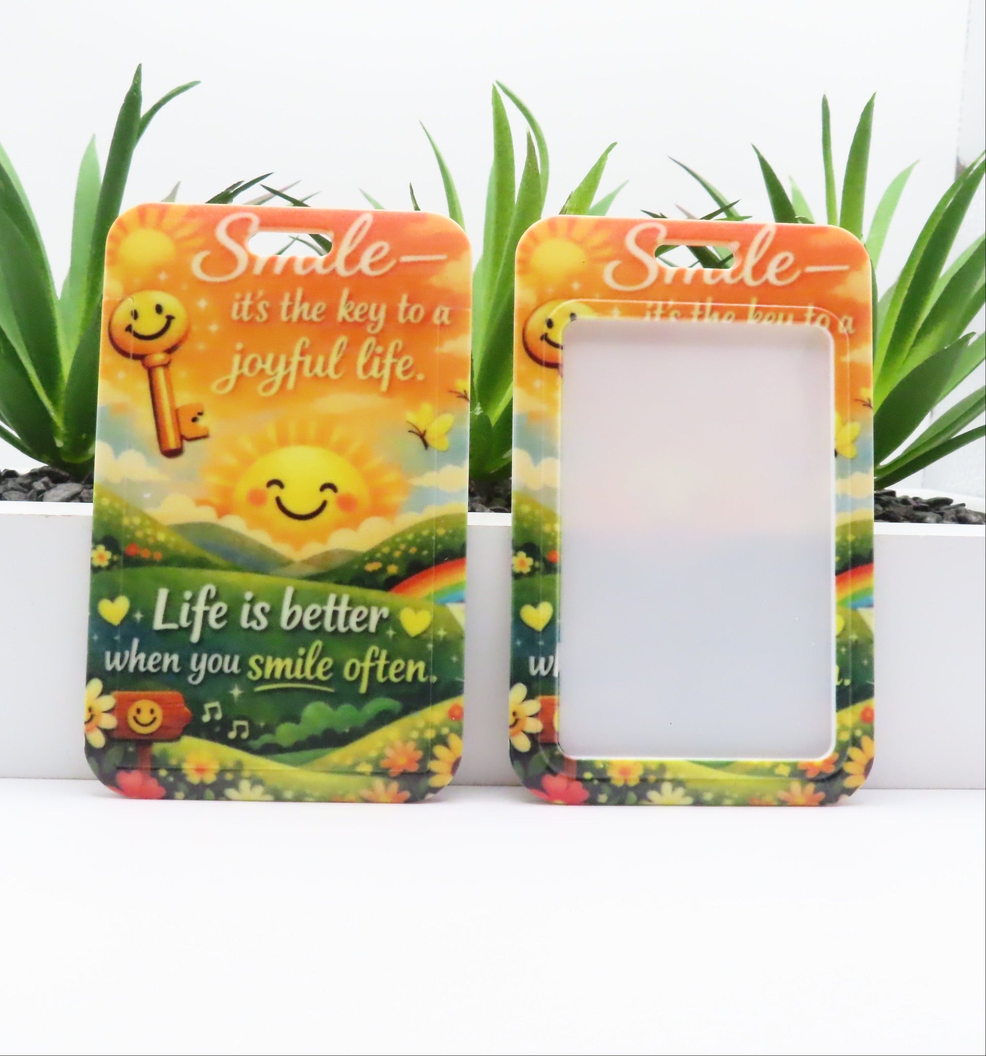 Two decorative picture frames with motivational quotes and smiley faces on a white background.