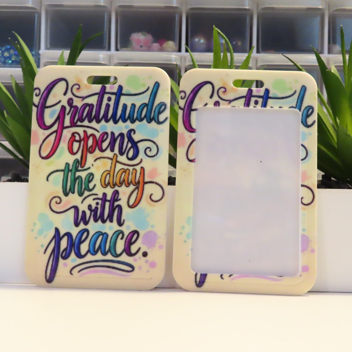 Two phone cases with motivational quote and colorful design on a white surface.