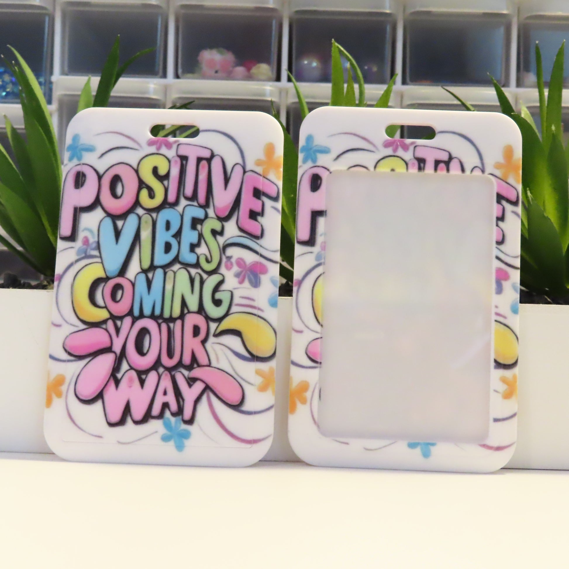 Phone case with 'Positive Vibes Coming Your Way' text on a white background