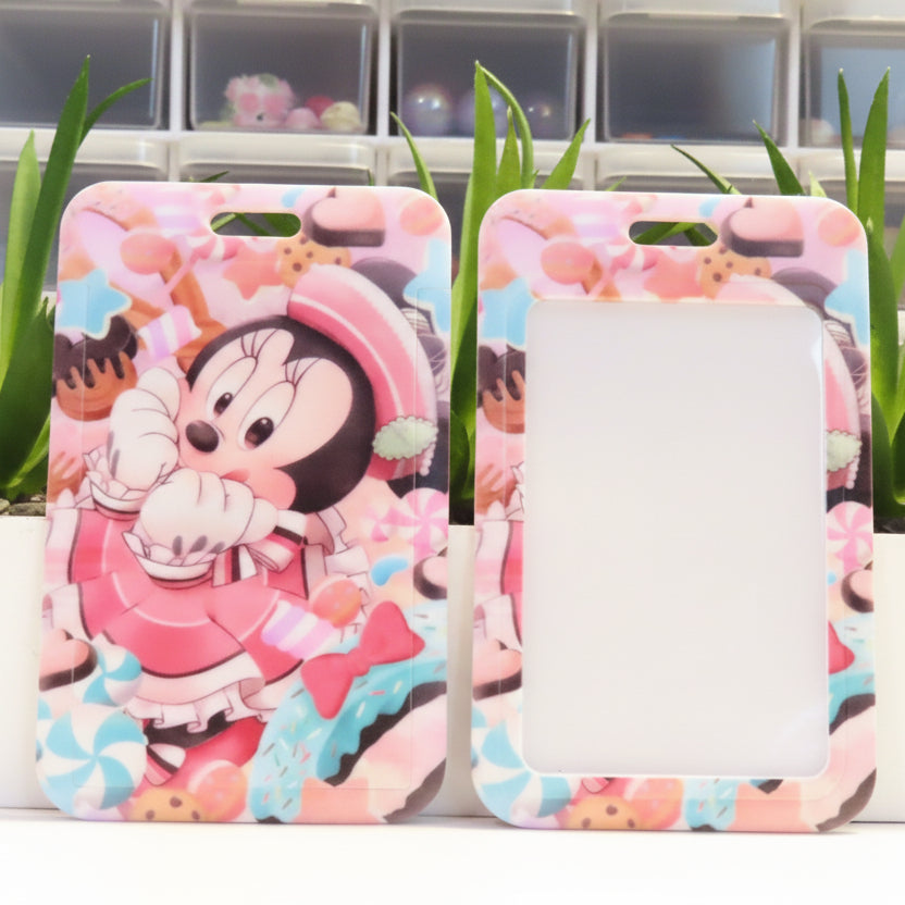 Two phone cases with cartoon character design on a white surface with plants in the background.