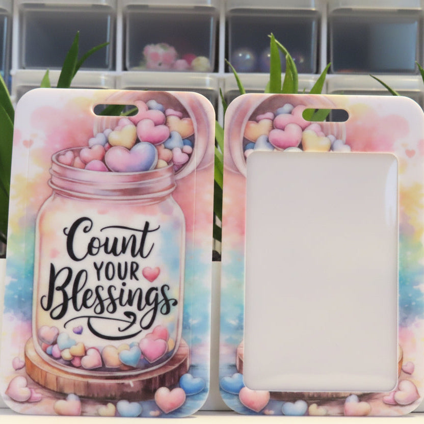 Phone case with 'Count Your Blessings' text and colorful design on a white surface.