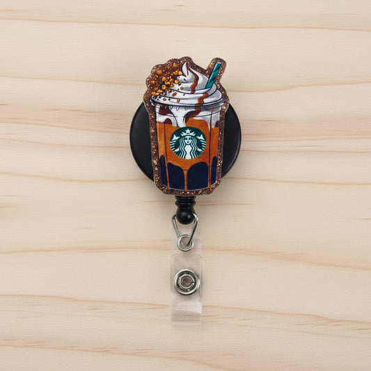 Starbucks-themed pin with a frappuccino design on a white background