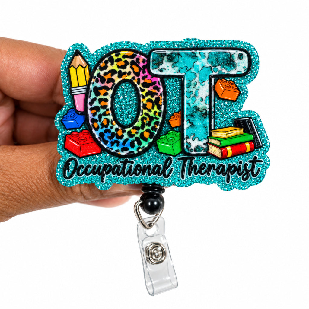A hand holding a custom glittery 'OT' badge reel with a black beaded strap. The lettering features leopard print, glitter textures, and colorful school-themed illustrations including a pencil, paintbrush, and books, with the phrase 'Other Teachers' written in script.