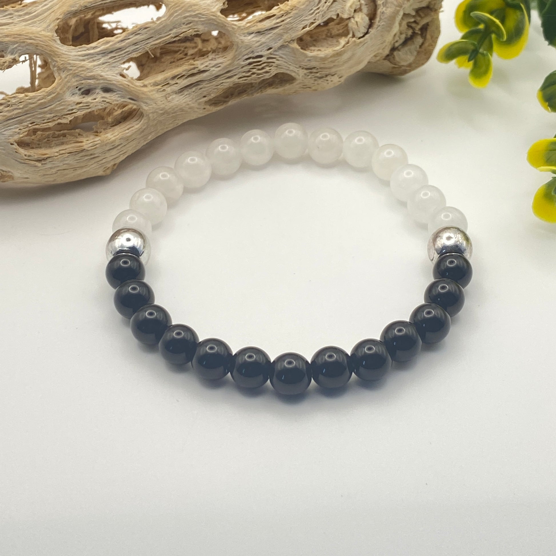 Bracelet with black and white beads on a light background