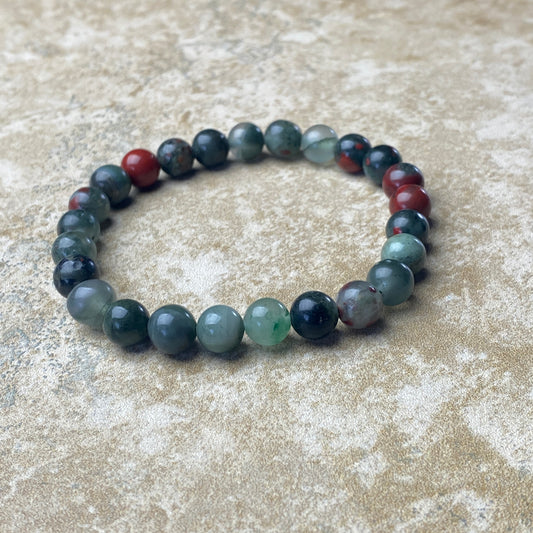 Beaded bracelet with multicolored beads on a textured surface