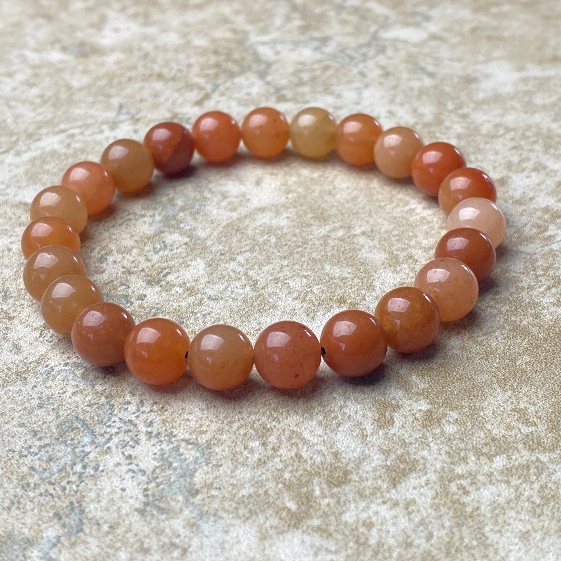 Round beaded bracelet on a textured surface