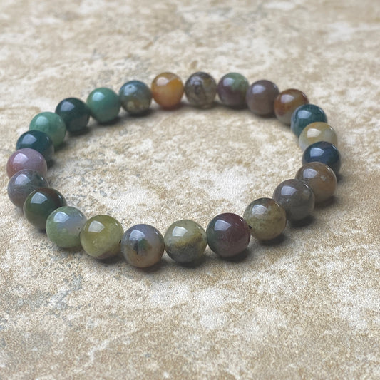 Multicolored beaded bracelet on a textured surface