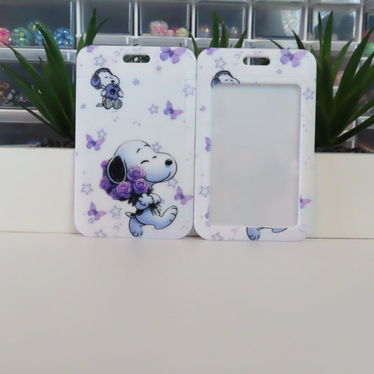 Two phone cases with cartoon characters holding flowers on a white surface.
