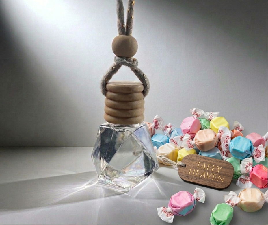 Perfume bottle with wooden cap on a gray background, surrounded by colorful candies.
