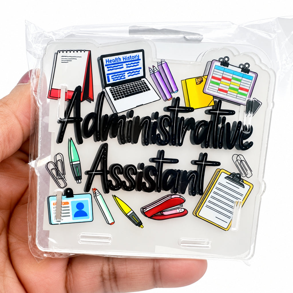A hand holding a clear plastic case containing a set of small colorful office-themed stickers with the words 'Administrative Assistant' in large black script.