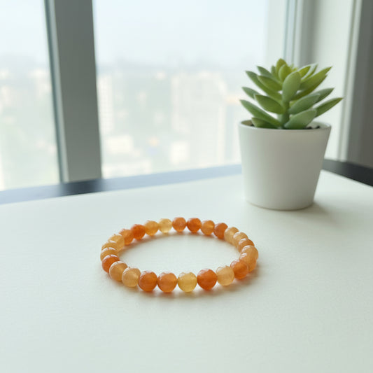 Beaded bracelet with multicolored beads on a dark wooden surface