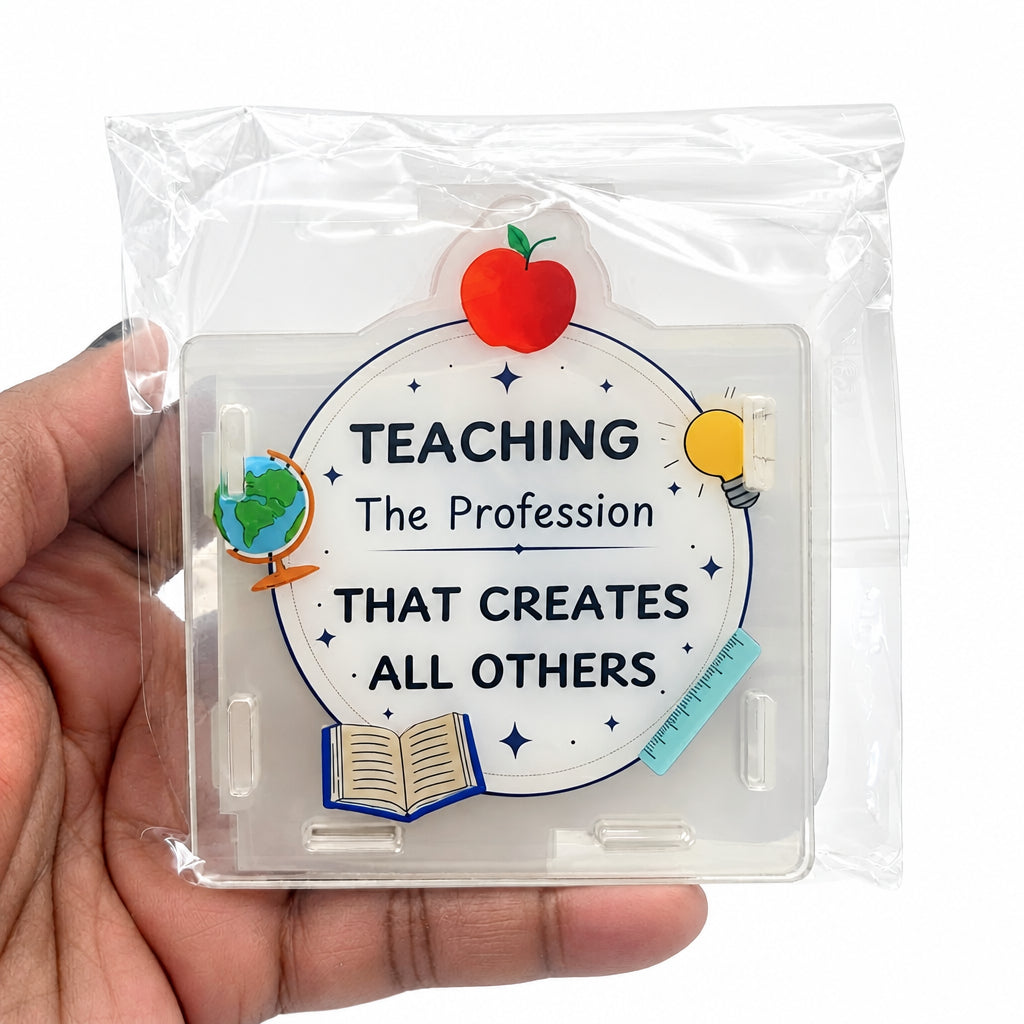 A hand holding a clear plastic case containing a circular sticker that reads 'TEACHING The Profession THAT CREATES ALL OTHERS' with school-themed illustrations including an apple, globe, book, and lightbulb.