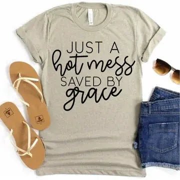Alt text: Hot Mess Saved By Grace t-shirt, handmade fun Christian shirt
